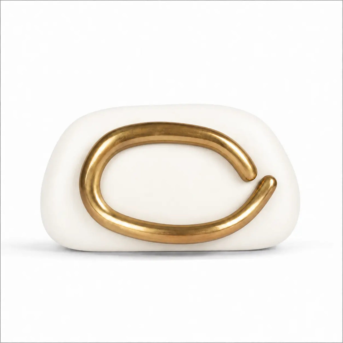 White pillow clutch with sculptural gold ring handle